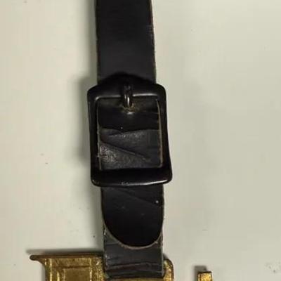 Vintage Avery Tractor Watch Fob, attached to a leather strap