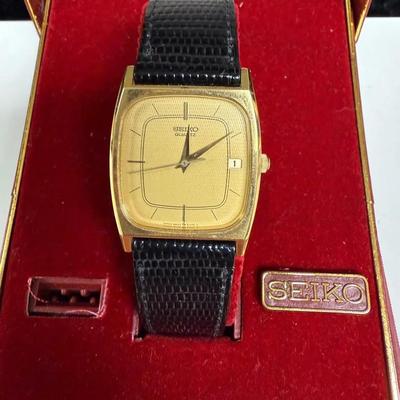 vintage Seiko Chariot 7431-5390 quartz watch with a gold-plated case and a black leather strap