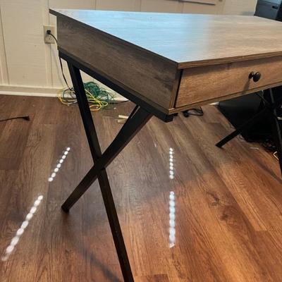 Sale Photo Thumbnail #44: $75 Contemporary desk, driftwood finish with metal frame, two drawers; 30 inches high by 43 1/4 inches wide by 20 1/2 inches deep.