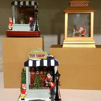 (3) Santa Toy Shop Light Up Decor & (2) Snow Globe Lanterns