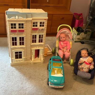 Dollhouse And Assorted Dolls And Accessories