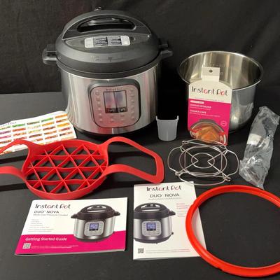 Six Quart Instant Pot Duo-Nova Multi-Use Pressure Cooker With Silicone Bakeware Sling - Never Used