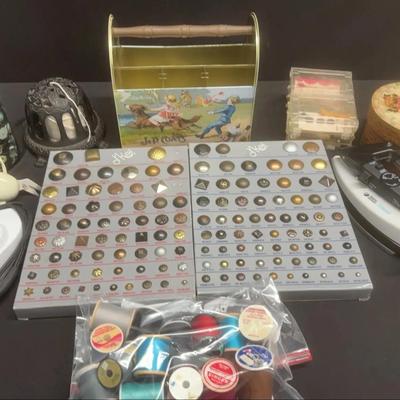 Lot of an assortment of vintage sewing supplies, and notions