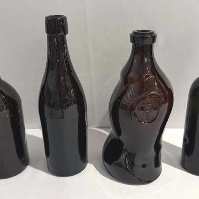 Collection of antique And Vintage Black Glass And Unique Bottles