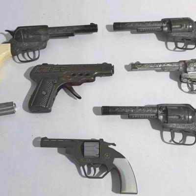 Collection of seven vintage diecast western and toy cap guns