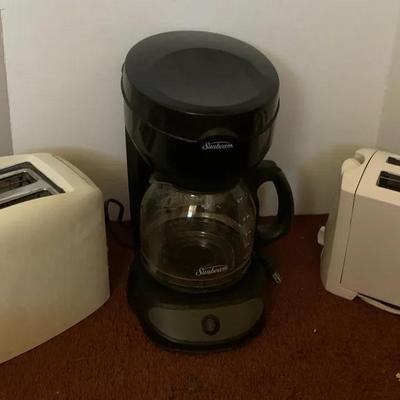Toasters And A Coffee Machine 
