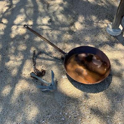 Large Rusted Pan And An Anchor 