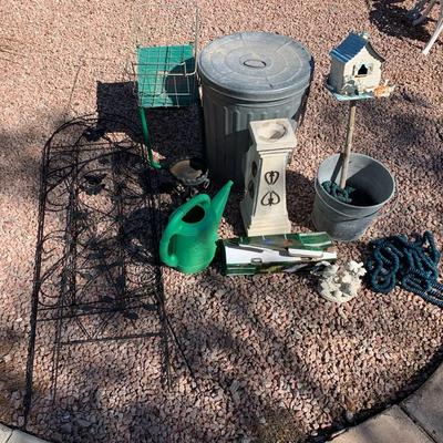 Yard Decor, Trash Can, And A Watering Can