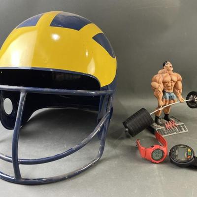 Sale Photo Thumbnail #28: Lot 44 – Extra Large Wolverines Helmet & More