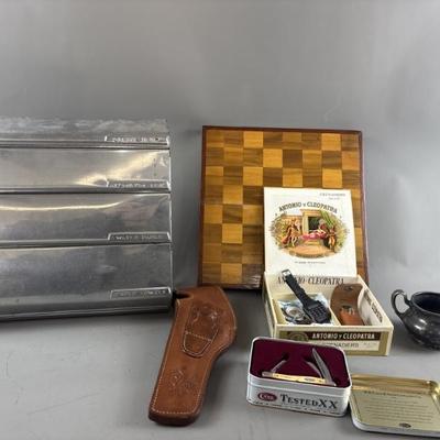 Sale Photo Thumbnail #132: Lot 148 – Leather Gun Holster, Pocket Knives & More