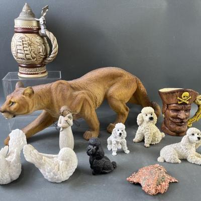 Sale Photo Thumbnail #24: Lot 40 – Resin Figurines, Avon Stein, Copper Ore & More