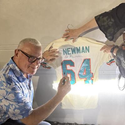 Former Dolphin signing jersey 