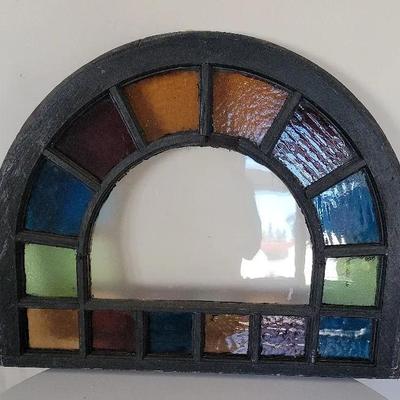 Stained Glass Window Panel In An Arched Frame
