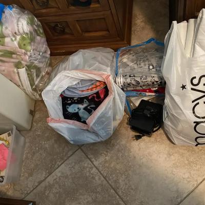 Sewing Machine With Assorted Fabrics Tools and Other Craft Items