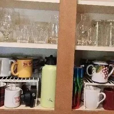 Shelves of Unique "Uff Da" Coffee Mugs, Beer Mugs & Other Glassware, Water Bottles, Lids