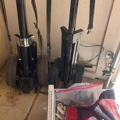 2 Golf Caddies Pull Carts With Box Of Golf Towels And Gloves