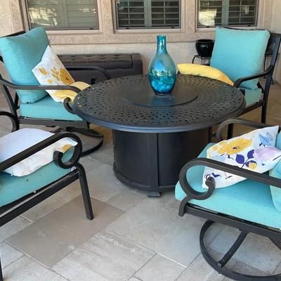 Outdoor Fire Pit Table With 4 Chairs - 2 Swivel - Teal Cushions, Yellow/Floral Throw Pillows