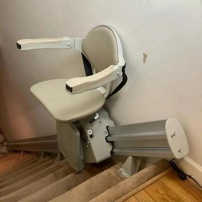 Sleek Stair Lift Chair with Wall-Mounted Track 