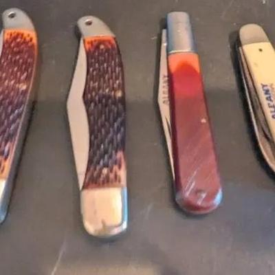 Lot of 4 Vintage Folding Pocket Knives – Assorted Handles Featuring Bowie Blades