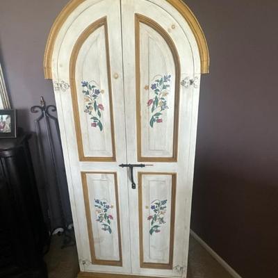 Decorative storage cabinet with arched doors