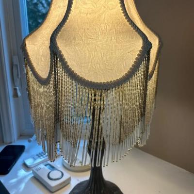 Victorian-style lamp with fringe shade