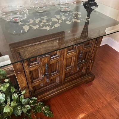 Sale Photo Thumbnail #100: buffet has a glass top and a beautiful inlay
