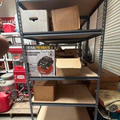 2166 • 3 metal shelving racks with magazine