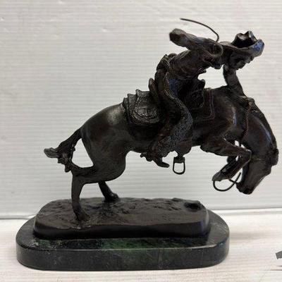 8127 • frederic remington ”the wooly chaps” bronze statue