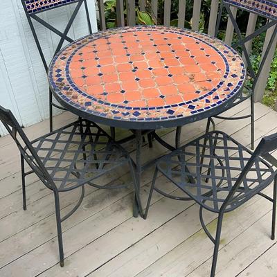 Tile Top Table With Four Metal Chairs 
