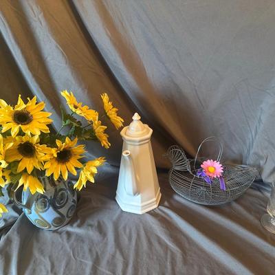 Collection of Home Decor: Sunflowers, Teapot, and Wire Basket