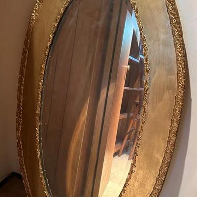 Antique Oval Gilt Wall Mirror With Carved Details