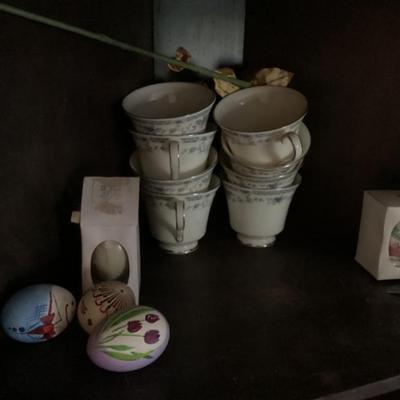 Coffee cups and decorative eggs