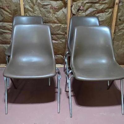 (4) Brown Molded Plastic Stacking Chairs 
