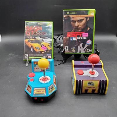 (2) Xbox Games and (2) Namco Joy Sticks