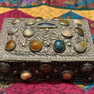 Silver trinket box adorned polished cabochon stones