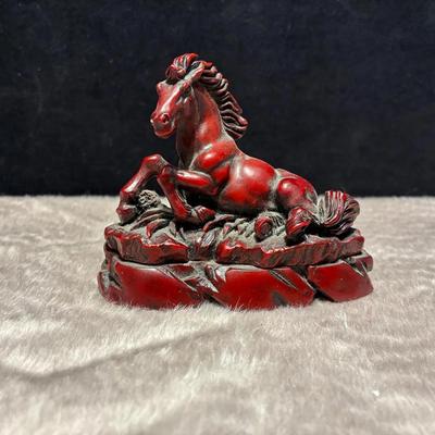 Chinese red resin horse carving