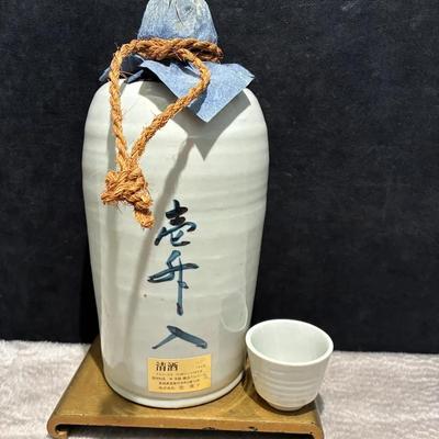 Ceramic sake bottle with cup