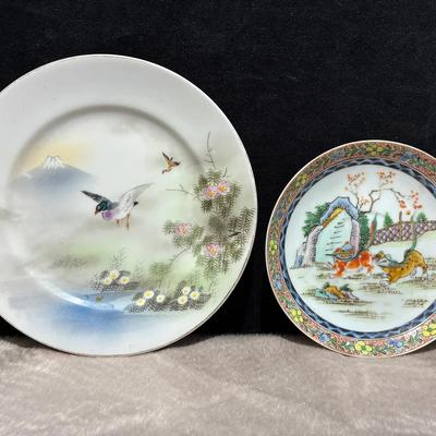 Handpainted porcelain plates with animal motifs