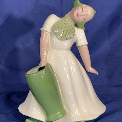 Vintage Hedi Schoop "Swooning Woman with Green Vase" porcelain figurine.