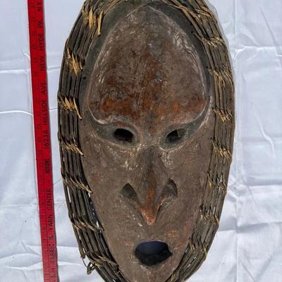 Carved Wood Face with Woven Rattan Frame