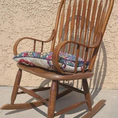 Cozy Wooden Rocker with Patchwork Cushion