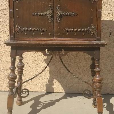 Rustic Charm: Ornate Antique Wooden Cabniet With Intricate Details