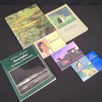 An Array Of Artsy Books And Postcards 