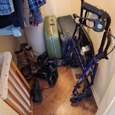 Suitcases.  Walker.  Wood laundry bin.