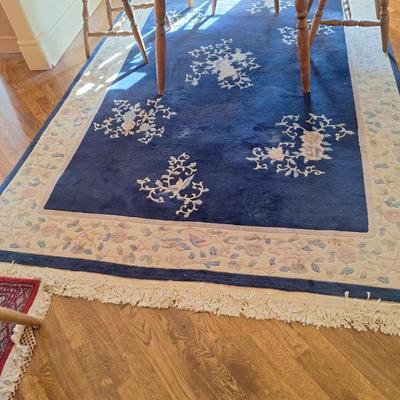 Large blue woven rug.