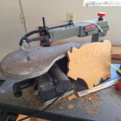 Craftsman saw.  Cute pig.