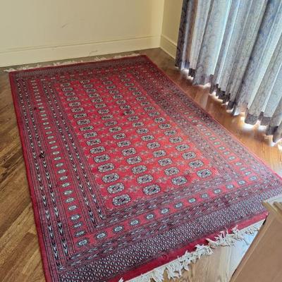 Large red woven rug.