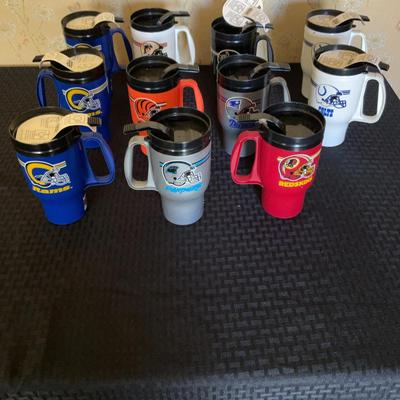 Collection of Travel Mugs from Various Sports Teams