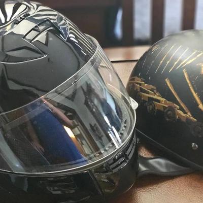 2 Motorcycle Helmets. 