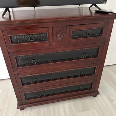dresser with leather drawings